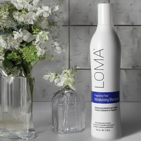LOMA 12 fl oz bottle beside common item for size comparison and convenient at-home use