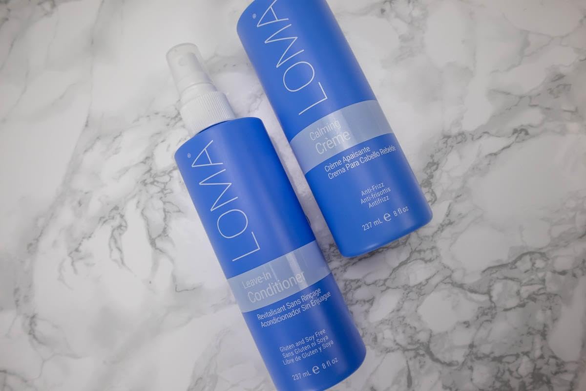 Loma leave-in size comparison in hand highlighting portable 8 oz convenience