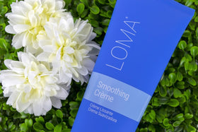 Loma applied by stylist in salon delivering visible frizz control and shine