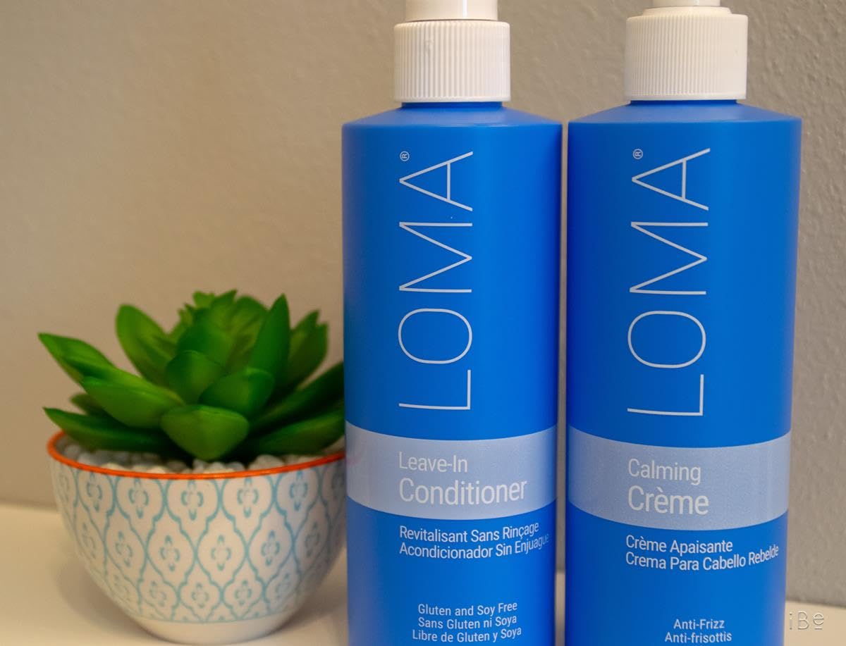 Loma leave-in being sprayed on damp hair for instant detangling and manageability