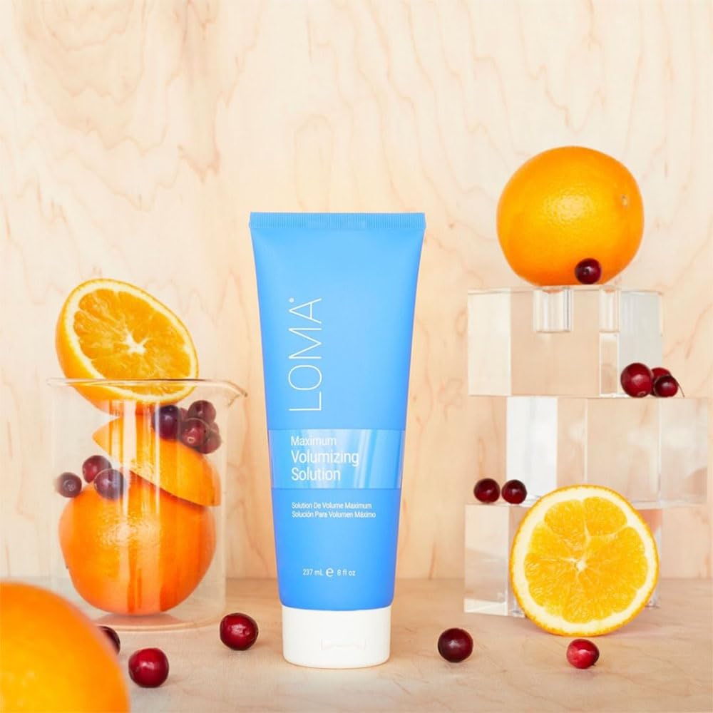 Loma size comparison with hand illustrating 8 fl oz portability and salon quantity