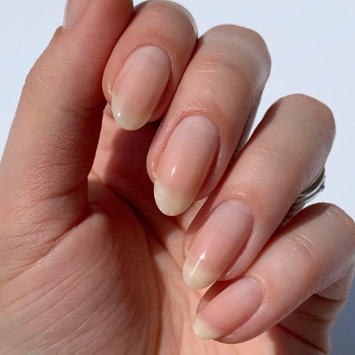 LONDONTOWN bottle open with brush stroke demonstrating smooth, buildable tint