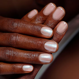 LONDONTOWN chrome glaze over dark base creating dramatic metallic depth