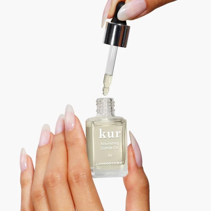 LONDONTOWN applying oil to cuticles demonstrating quick massage and immediate softening benefit