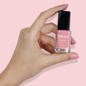 LONDONTOWN Desert Flower bottle next to a coin showing compact 0.4 fl oz travel-friendly size
