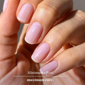 LONDONTOWN hand in natural light showing subtle, healthy-looking manicure result