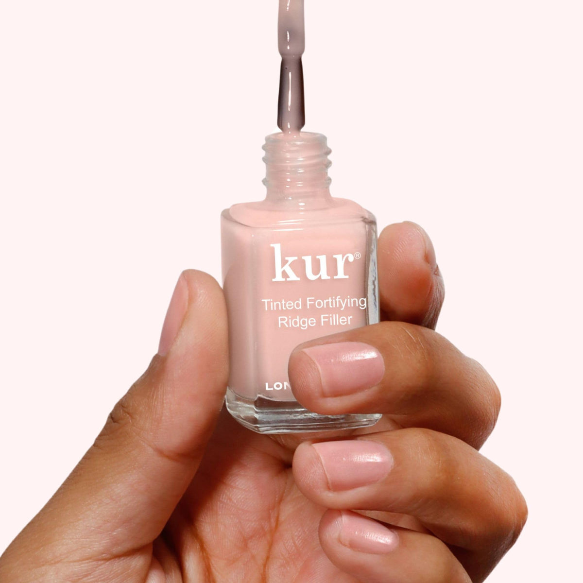 LONDONTOWN Kur close-up of nail surface showing filled ridges benefit