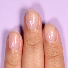 LONDONTOWN kur Top Coat close-up of iridescent texture enhancing sparkle benefit