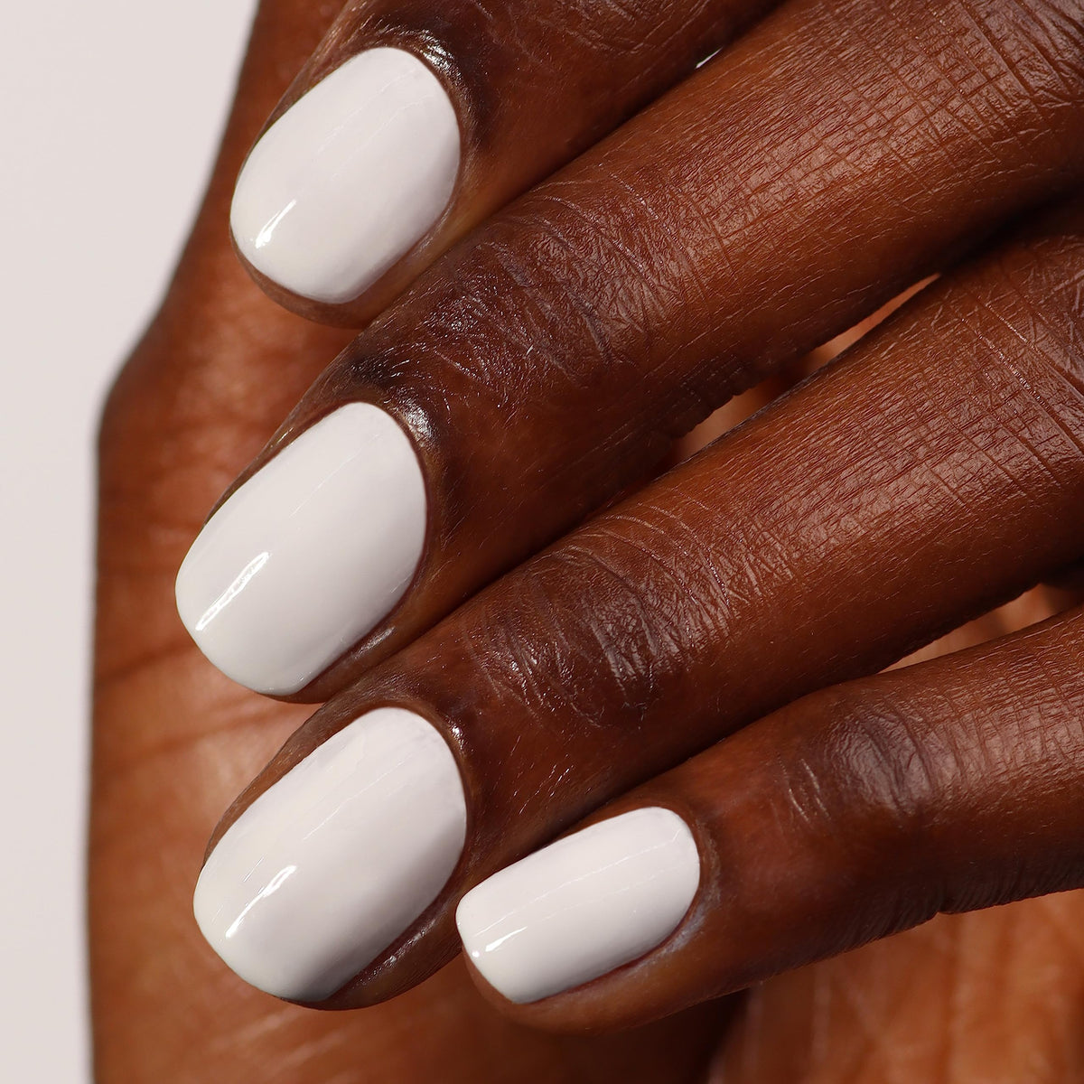 LONDONTOWN polish applied on fingertips showing smooth streak-free finish