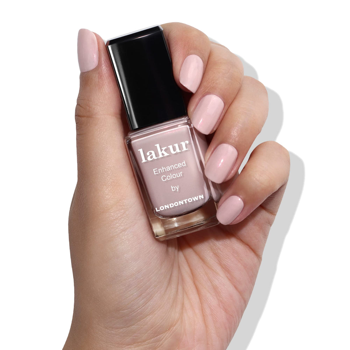 LONDONTOWN Lakur bottle next to drying oil to speed dry and protect nails