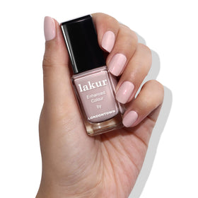 LONDONTOWN Lakur bottle next to drying oil to speed dry and protect nails