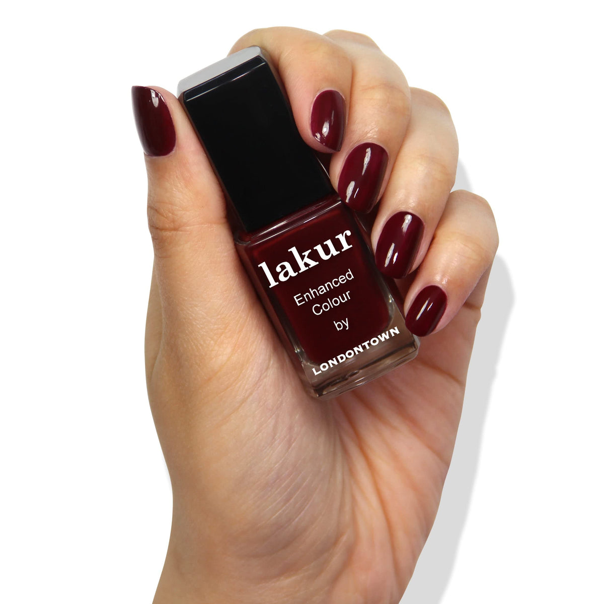 LONDONTOWN hand swatch showing Elderberry Red on nails for true color preview