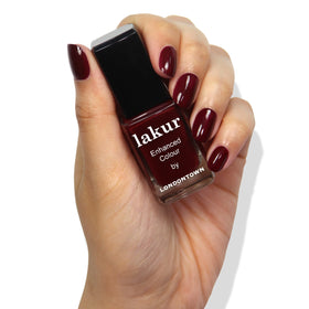 LONDONTOWN hand swatch showing Elderberry Red on nails for true color preview