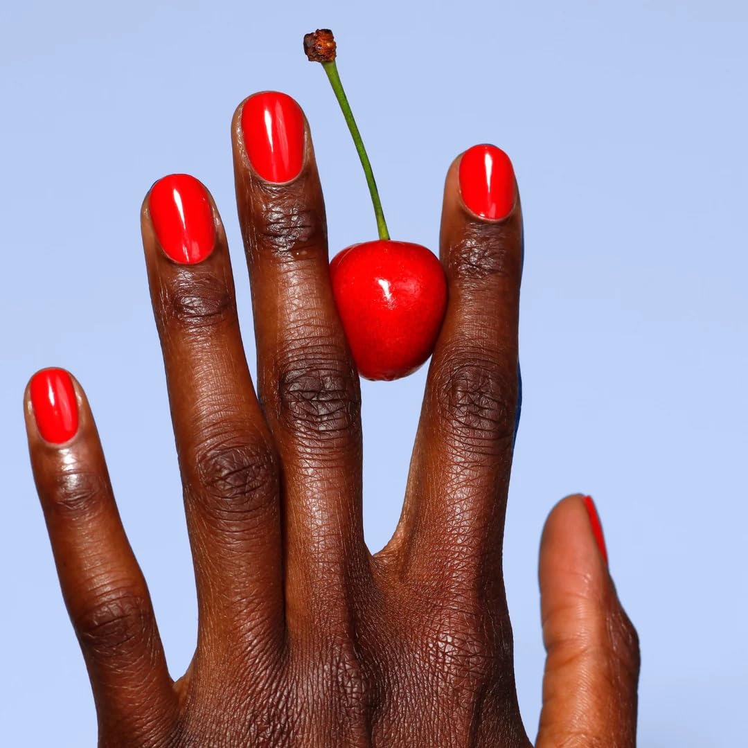 LONDONTOWN swatch on hand displaying true Maraschino Cherry pigment payoff