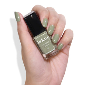 LONDONTOWN nail swatch with Sedona green on a single nail showing rich, opaque color payoff