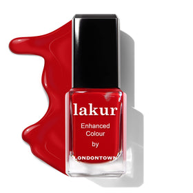 LONDONTOWN Lakur bottle beside a coin to show compact 0.4 fl oz travel-friendly size