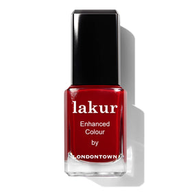 LONDONTOWN polish on vanity styled with flowers suggesting salon-quality, clean beauty