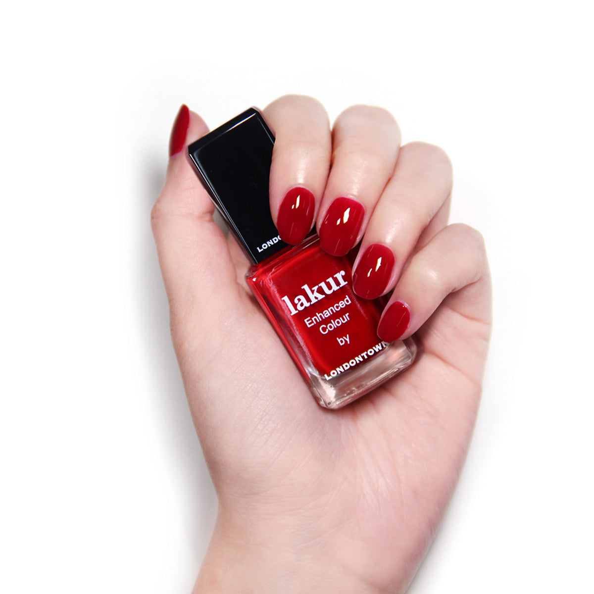 LONDONTOWN nail swatches under varied light showing true Vendetta red payoff