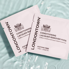 LONDONTOWN pads in a handbag lifestyle shot for on‑the‑go nail care convenience