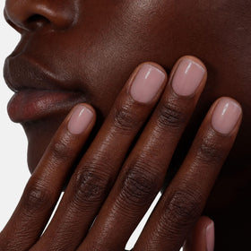 LONDONTOWN manicure lifestyle on desk showing polished nails and everyday elegance benefit