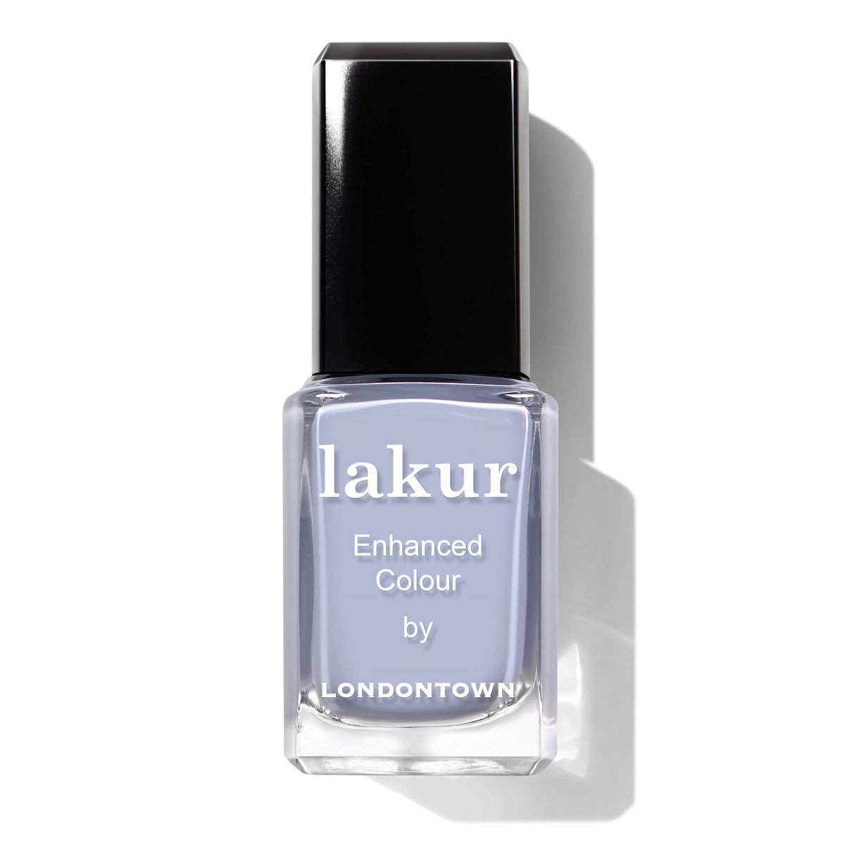 LONDONTOWN manicure on hands at table showcasing everyday wearability benefit