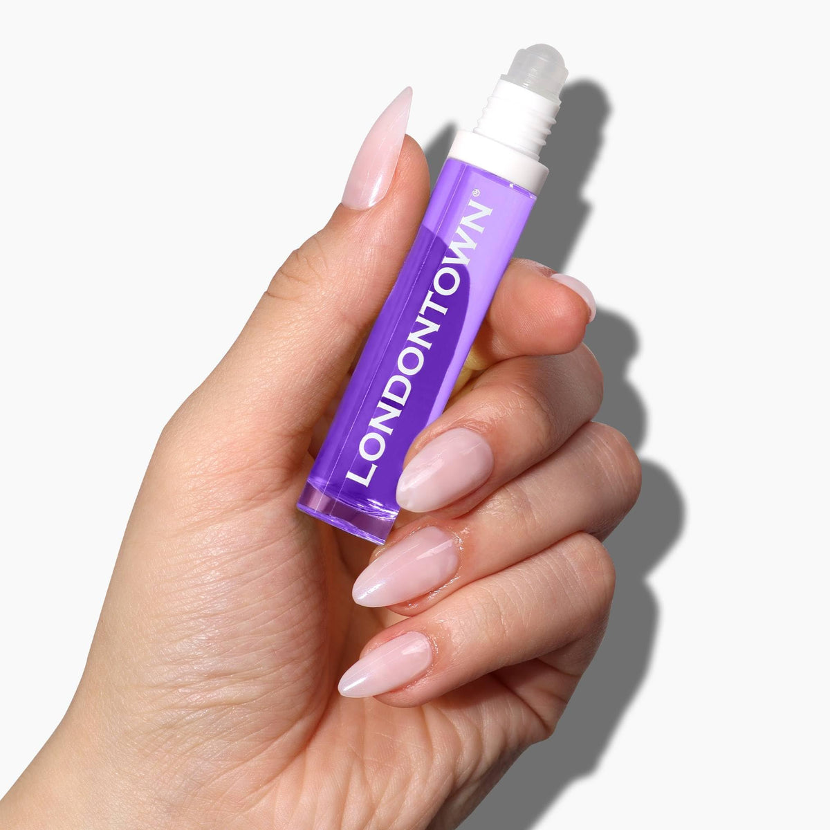 LONDONTOWN rollerball closeup highlighting smooth applicator for precise, mess-free use