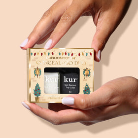 LONDONTOWN duo next to a passport showing travel-ready compact nail care