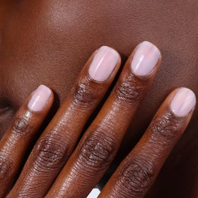 LONDONTOWN nail with top coat showing enhanced gloss and longer wear benefit