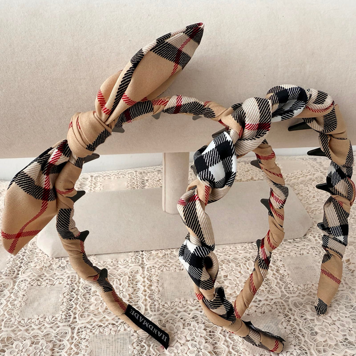 LONEEDY headband held in hand showing lightweight size and easy portability