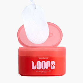 LOOPS serum texture drop on fingertip demonstrating lightweight hydration and smooth finish