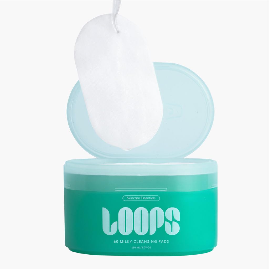 LOOPS milky oil texture on fingertip highlighting nourishing formula and hydrating feel