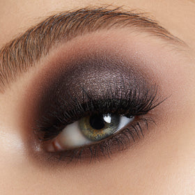 LORAC compact beside makeup brush to show lightweight size and kit-fit