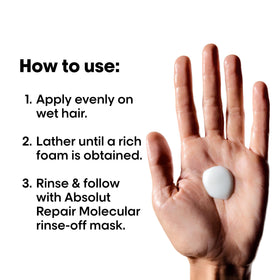 L'Oréal Professionnel Paris bottle held in hand showing scale and travel-friendly benefit