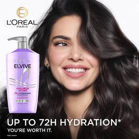 L'Oreal Paris conditioner close-up showing creamy texture and detangling