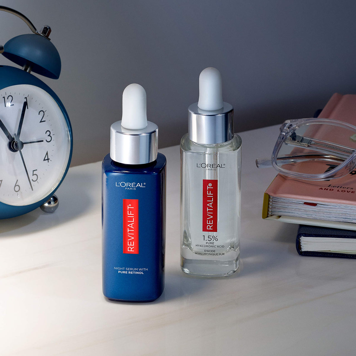 L'Oreal Paris serums styled on bathroom shelf to suggest everyday skincare integration