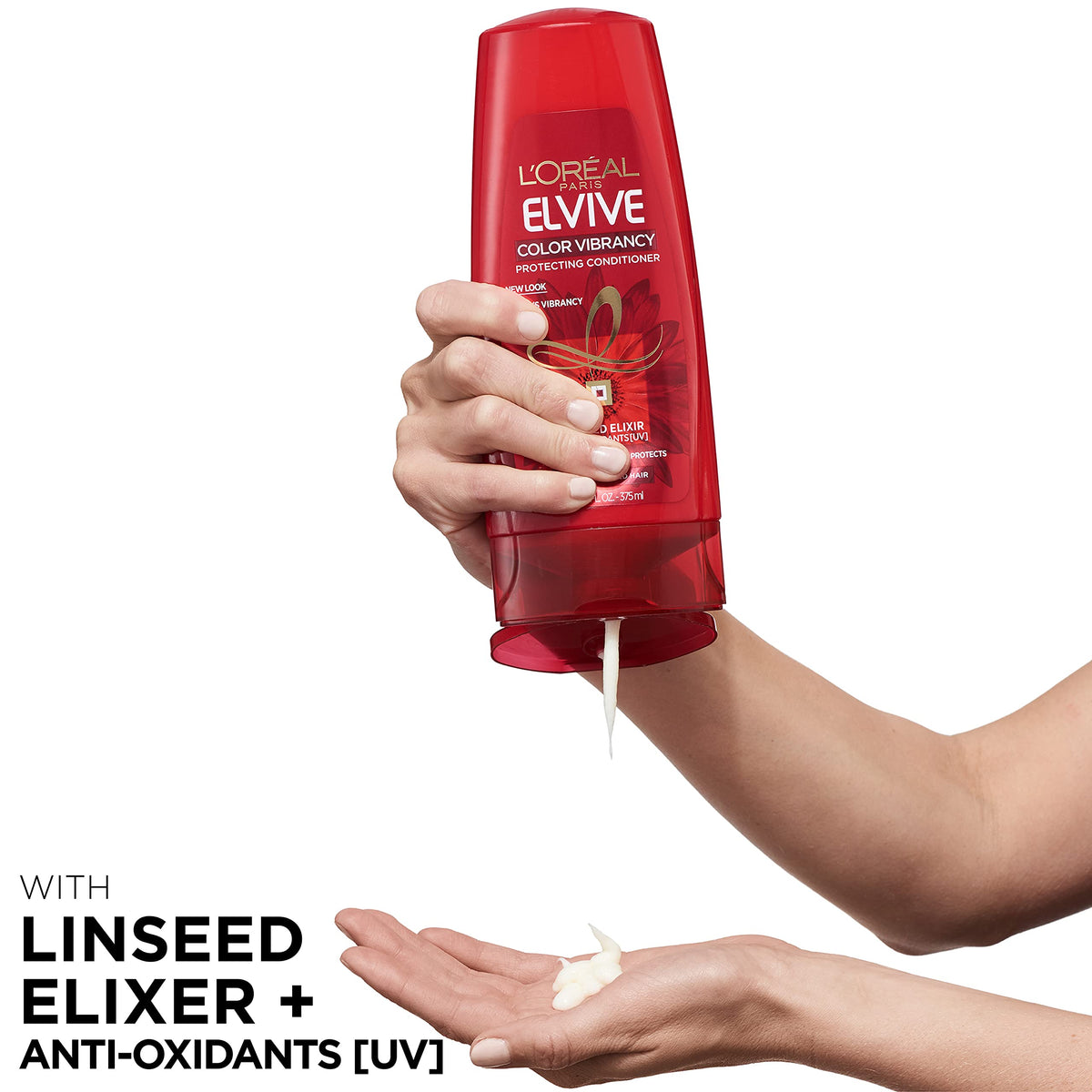 L'Oreal Paris bottle in hand for scale and ease-of-use benefit