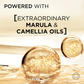 L'Oréal Paris 100ml bottle beside everyday objects to show compact travel-friendly size