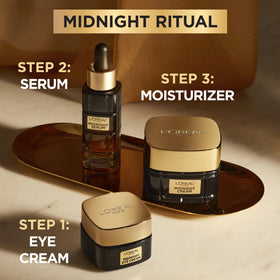 L'Oreal Paris eye cream on vanity in bedroom scene suggesting overnight restorative routine