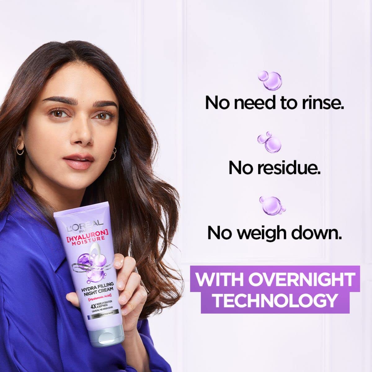 L'Oreal Paris applying cream to dry hair ends to reduce tangles and dryness