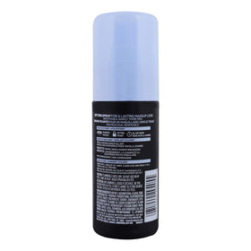 L'Oreal Paris spray held in hand to show 3.4 ounce size and portability
