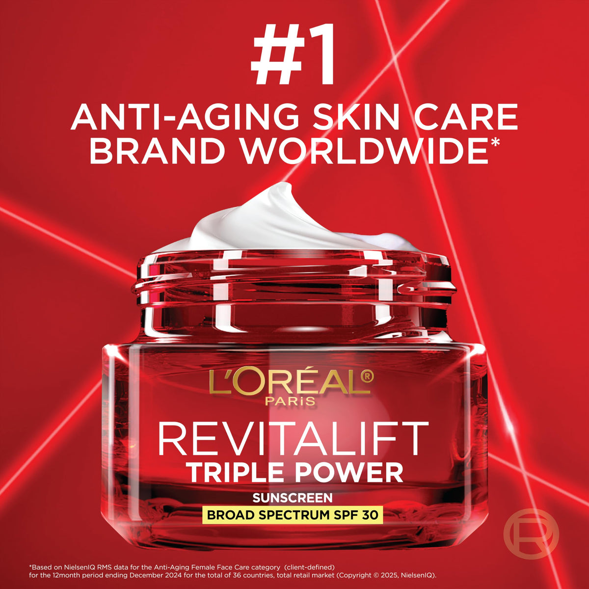 L'Oreal Paris tube next to a coin for scale showing compact size and travel-friendly benefit