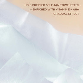 L'Oreal Paris applying towelette on arm for streak-free tan