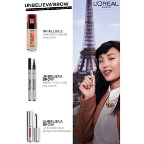 L'Oreal Paris applicator in hand applying topcoat for easy use