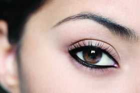 L'Oreal Paris model applying eyeliner for quick defined eye look