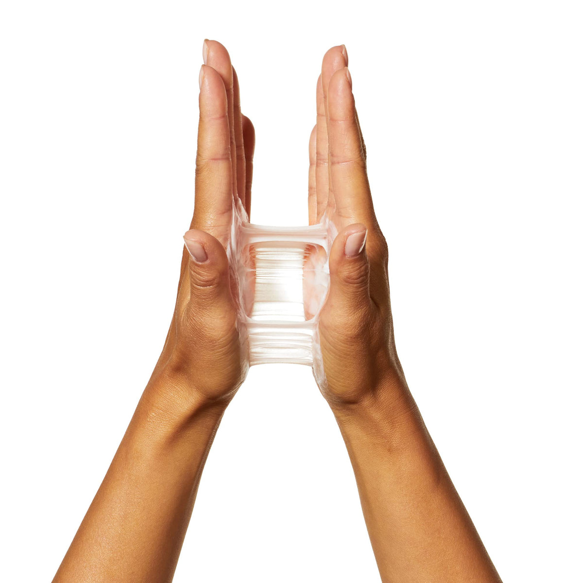 L'Oréal Professionnel Paris next to a hand for size comparison and travel-friendly use
