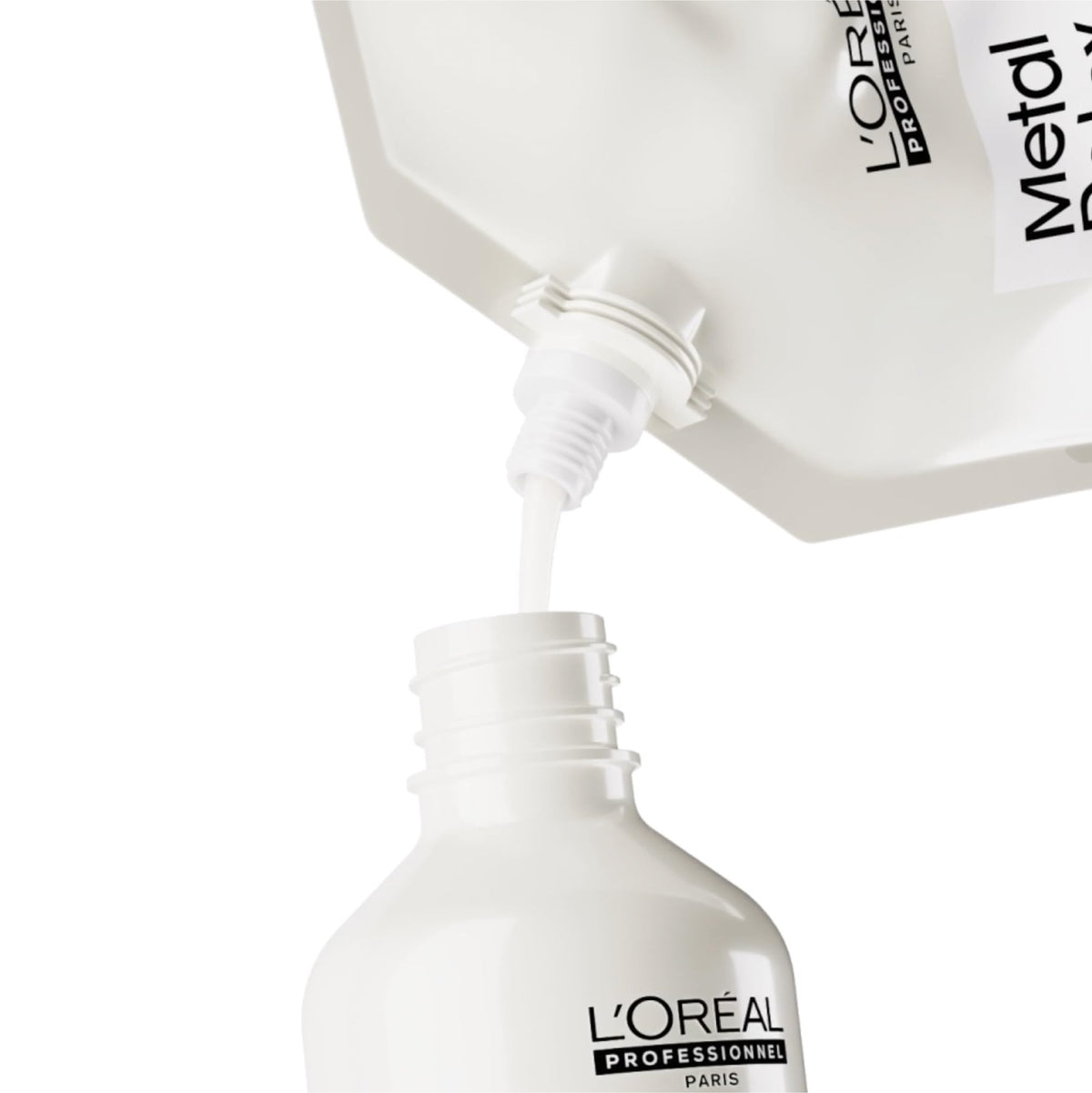 L'Oréal Professionnel refill beside 16.91 fl oz bottle for scale reference
