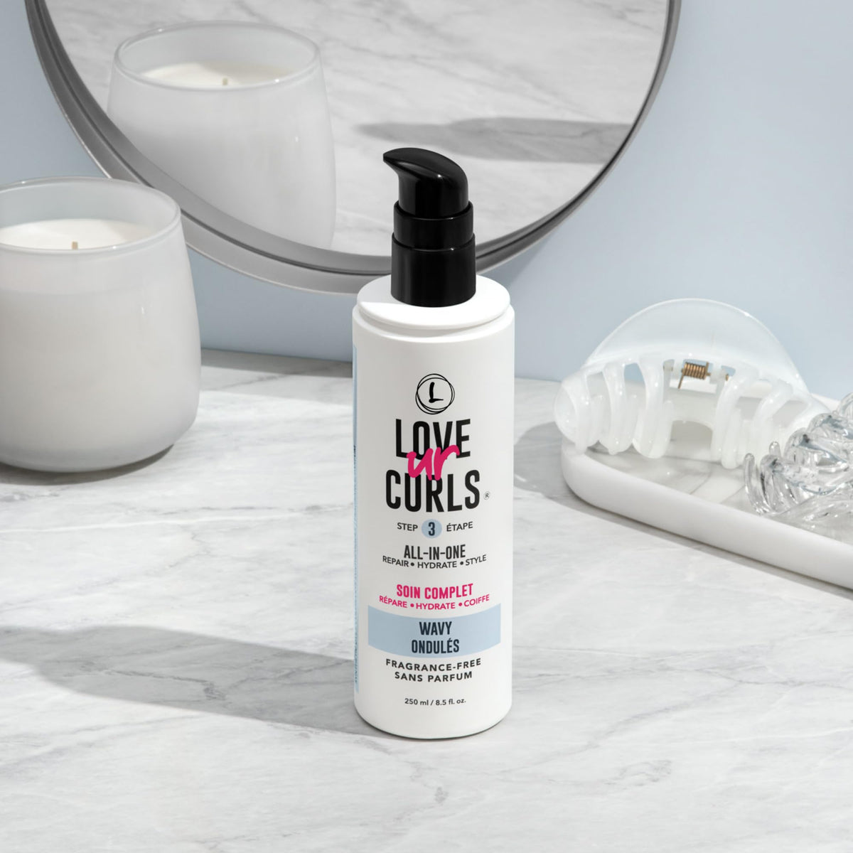 Person scrunching wavy hair with Love Ur Curls cream applied to define and reduce frizz