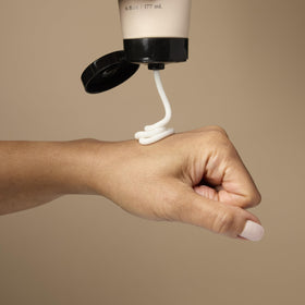 Loved01 size comparison with hand to show jar scale and convenient 6 oz portability