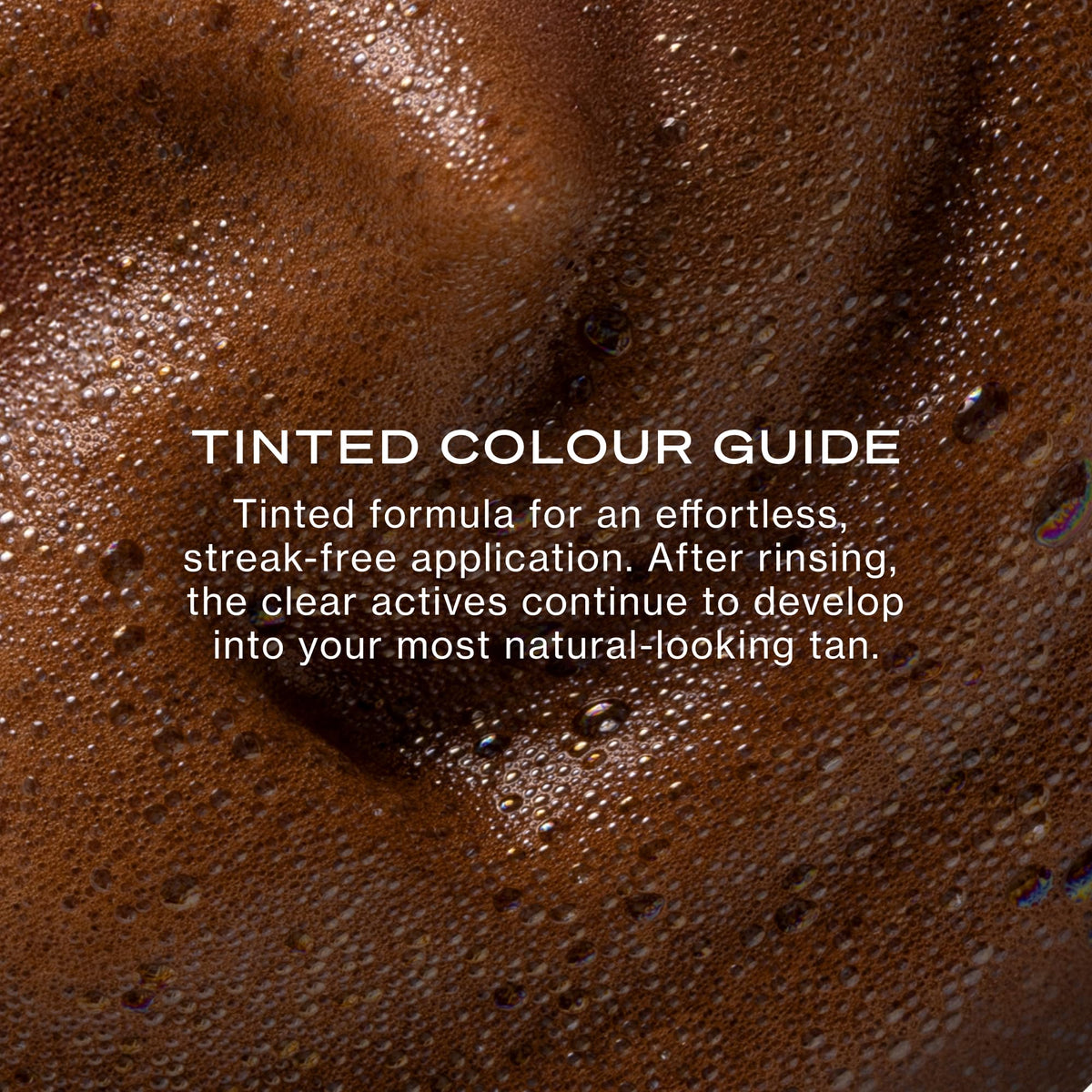 Loving Tan mitt applying mousse to arm for streak‑free blending benefit