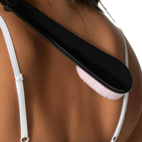 Loving Tan folded applicator beside hand showing portable storage benefit